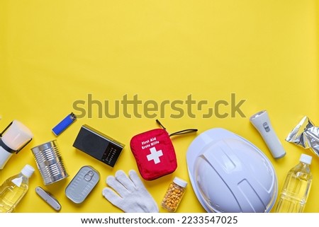 Emergency equipment on yellow background