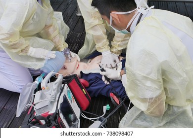 Emergency Exercise Treatment Given By Paramedic With Cardio Pulmonary Resuscitation (CPR) Was Performed On A Male Dummy And Automated External Defibrillator (AED) Machine Ready. 