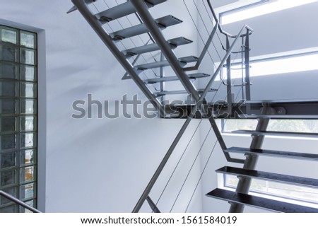 Emergency exit by a stairwell in a modern building