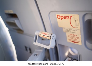 Emergency Exit Door On An Aircraft,View From Inside Of The Plane, Emergency Pull Up