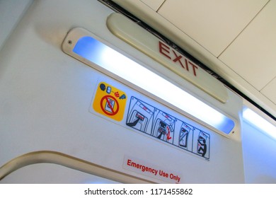 Emergency Exit Door On The Fuselage Of A Passenger Aircraft