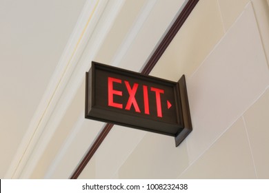 Emergency exit sign hanging on the wall