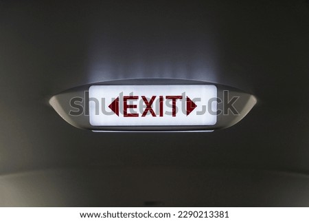 Emergency exit sign inside an airplane