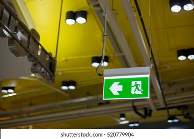 Emergency exit sign in modern offices inside an industrial plant.