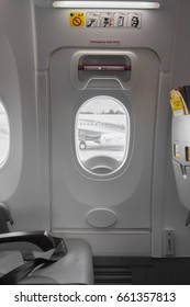 Emergency Exit Sign On Door In Airbus Plane Interior