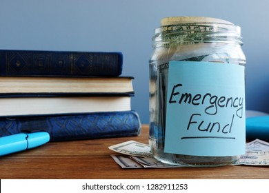 Emergency Fund Written On A Jar With Money.