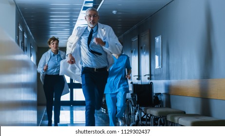 Emergency in the Hospital, Doctors and Nurses Running through the Hallway, in a Hurry to Save Lives. - Powered by Shutterstock