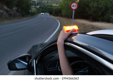 Emergency light for damaged vehicles (luminous beacon V16) dgt, mandatory to replace by triangles. - Shutterstock ID 1994366363