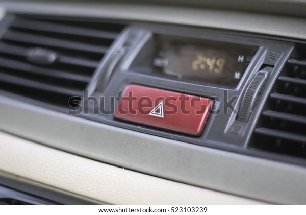 emergency lights button\
car