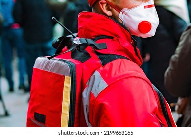 An Emergency Medic Worker In A Red Uniform And Face Mask Stands On The Street During The Protest. Illnesses. Injured. Injury. International. Life. Life Guard. Man. Medic. Medical. Medicine. Nurse