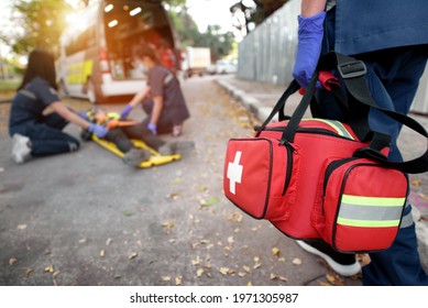 Emergency Medical First Aid Kit Bags Of First Aid Team Service For An Accident In Work Of Worker Loss Of Function In Limbs, First Aid Training To Transfer Patient