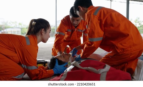 Emergency Medical Technician Asian Woman (EMT) Or Paramedic Team Is Holding Manual Stabilization Of The Head Patients, Emergency Medical Services (EMS) Nurses Concept