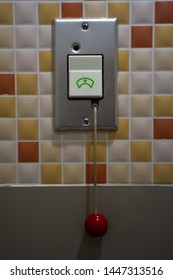 Emergency Nurse call equipment in the bathroom. Press the button or pull cord for nurse assistance.