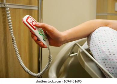Emergency Panic Button at hospital with Female finger close up view