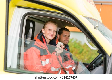 Emergency Paramedic In Ambulance Car Talk Radio Smiling Confident