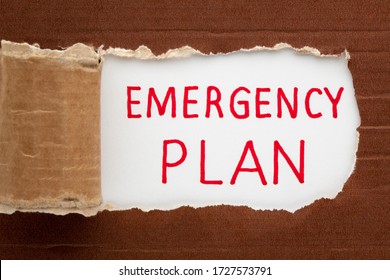 Emergency Plan Text Under Torn Paper. Business Concept