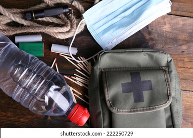 Emergency preparation equipment on wooden background