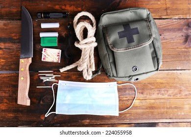 Emergency preparation equipment on wooden background