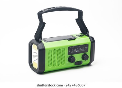 Emergency radio with flashlight rechargeable using built-in hand crank or solar cell