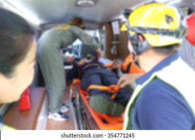 Emergency Response Team Help The Victim With The First Aid Treatment In The Ambulance