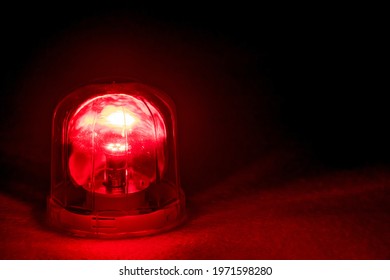 Emergency rotating alarm red light at night. - Powered by Shutterstock