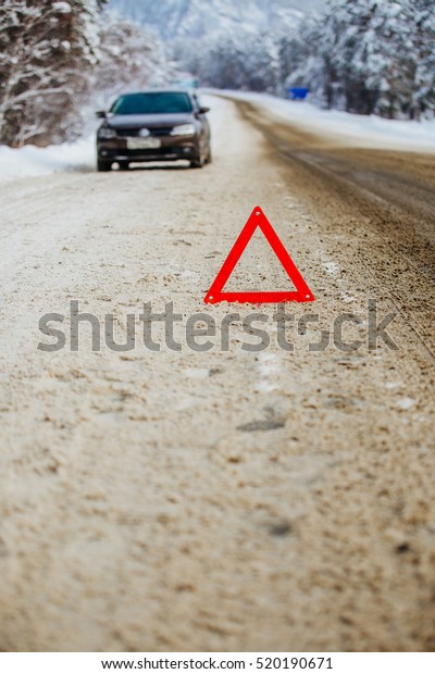 emergency sign on the side of the road in the\
winter in the\
mountains\
