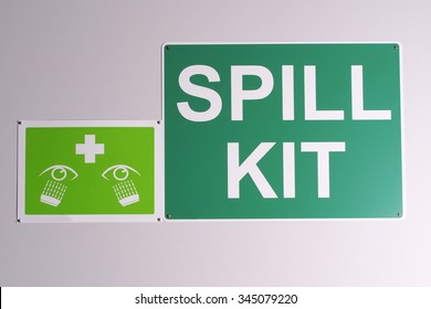 Emergency Spill Kit Wall Signs In Green On Off White Background On A Wall, Australia 2015