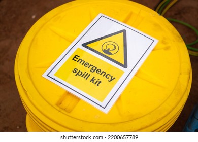 "Emergency spill kit" yellow plastic containment box. Safety sign and symbol at industrial equipment.  - Shutterstock ID 2200657789