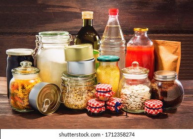 Emergency Stockpiling Of Various Food, On Top Of Wooden Background.