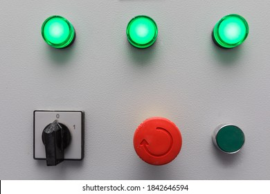 Emergency stop button and other electronic buttons in manufacturing facility - Powered by Shutterstock