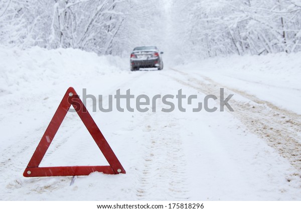 Emergency\
stop car on winter road in the\
countryside.