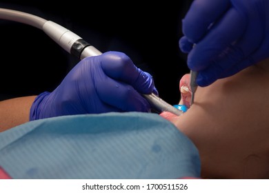 Emergency Surgery Performed By Dentist On Young Child During Corona Virus Outbreak. Health Insurance, State Of The Art Technology, European Hospital System. Orthodontist Close Up Shot While Operating.