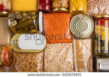 Emergency survival groceries on kitchen table closeup flat lay