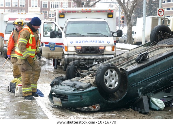 Emergency\
workers respond to a single vehicle\
rollover.