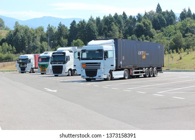 Emilia-Romagna, Italy- 18 July 2014: Four Lorries In A Motorway Service Station.