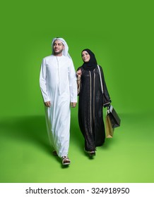 Emirati Couple Carrying Shopping Bags