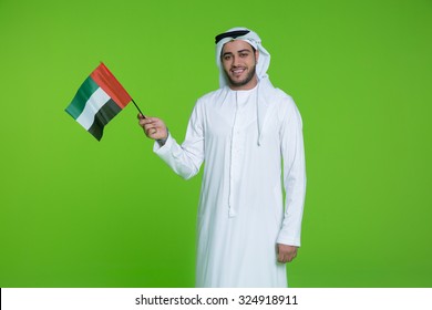 Emirati Man Holding UAE National Flag