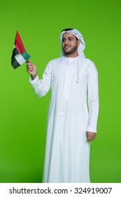 Emirati Man Holding UAE National Flag