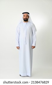 Emirati Young Man Standing In UAE Full Body Wearing Traditional Dress Isolated On White Background