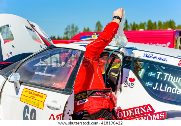 Emmaboda, Sweden\
- May 7, 2016: 41st South Swedish Rally in service depot. Crew\
working on Citroen Ds3 at team Thunstrom (68). Someone removes a\
tube of liquid from the drivers\
place.