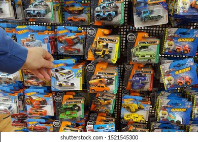 EMMERICH, GERMANY - FEBRUARY 19, 2019: Die-cast Toy Cars In A Blister Pack In A Store Display. Collection Of Small Die-cast Toy Model Vehicles.