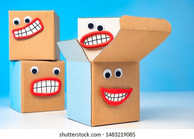 Emoji. Four Cardboard Boxes With Faces. Positive Shopping Experience. Parcel Delivery. Sale Of Packaging Materials. Online Trading With Home Delivery.