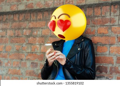 Emoji Head Woman Using A Smartphone. Emoji Concept