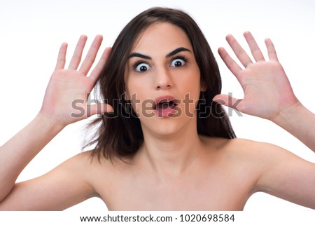 Emotion Concept. Beautiful Woman making funny gesture with her face. isolated
