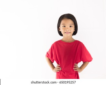 Emotion Confident children concept. Asian girl child red shirt on white background. She raise right and left hand to akimbo and smile. She confident cheerful child show wisdom of her expression. - Powered by Shutterstock