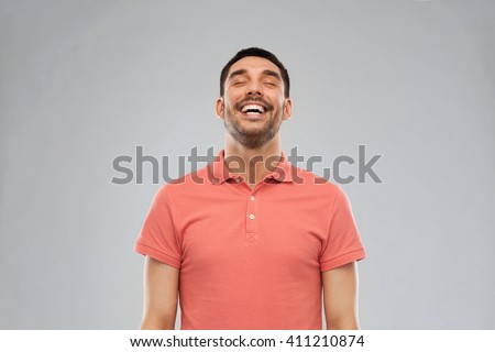 emotion and people concept - laughing man in polo t-shirt over gray background