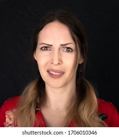 Emotion Really,  Are You Serious. Closed Portrait Of Woman Face With Facial Expressions Over Black Background. One Photo From A Series