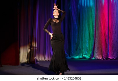 Emotional Actress In Black Dress Dancing And Playing A Role On The Stage Of The Theater. Flamenco Dance