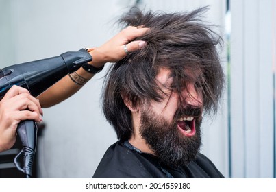 So Emotional. Beauty And Fashion. Hair And Beard Styling. Confident Brutal Guy With Barbershop Professional Master. Hipster Blow Dry Hair. Male Barber Care. Bearded Man At Hairdresser Chair In Salon
