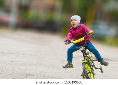 Emotional Boy Learning To Ride A Bike